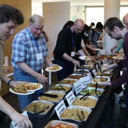 Photo of attendees grabbing food at the event
